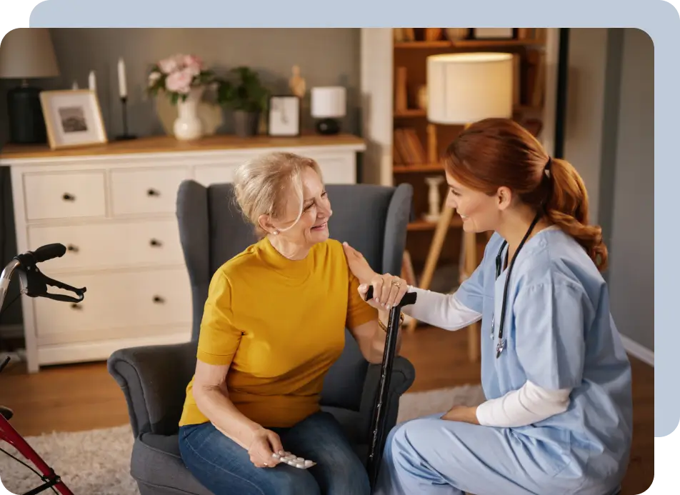 Elderly woman and caregiver in conversation